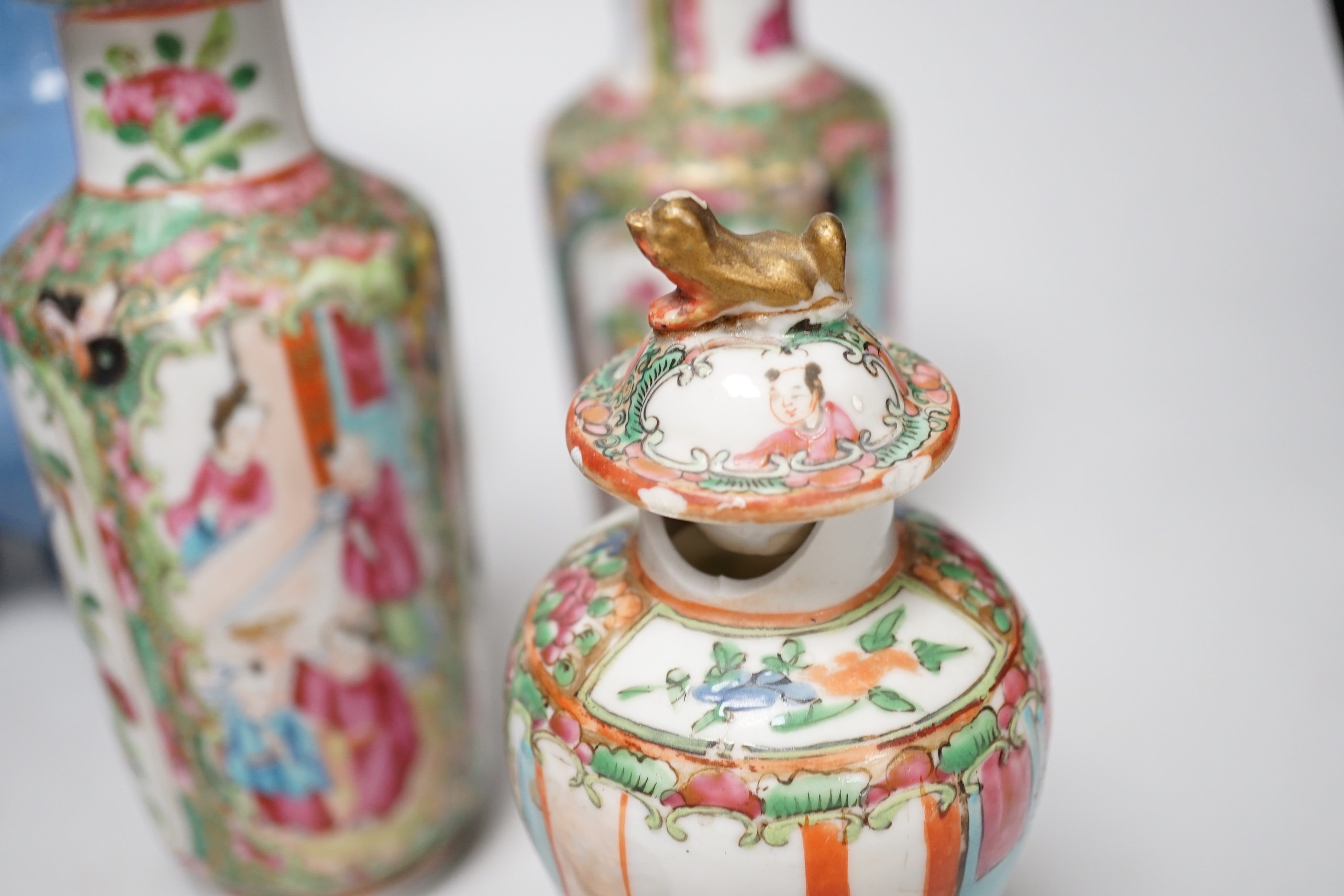 Chinese ceramics including a pair of Canton vases, baluster jar and cover and enamelled matchbox holder, the largest 24cm high